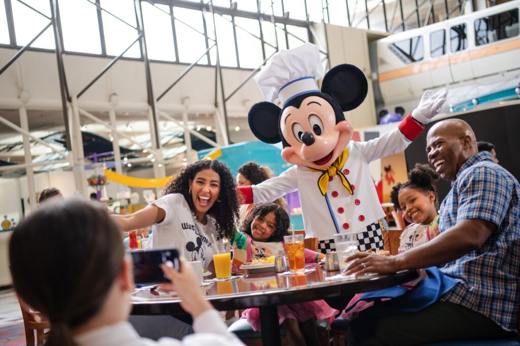 Family enjoying a Disney character dining experience.
