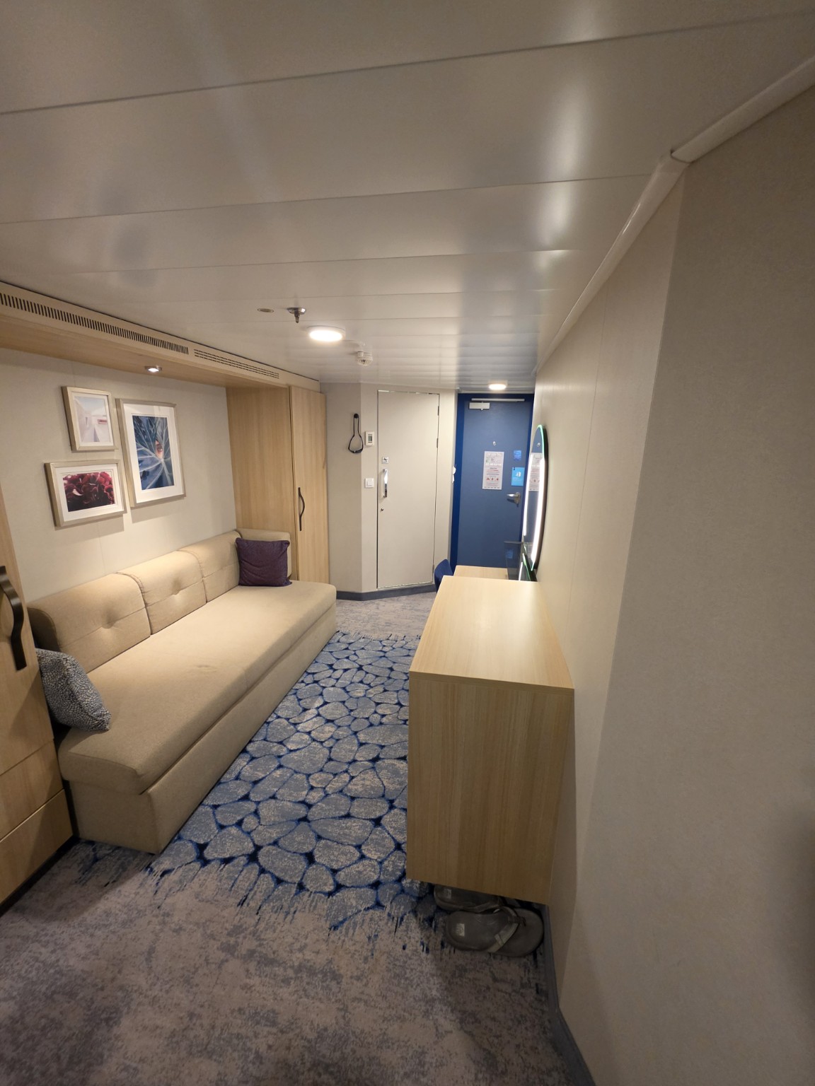 Full view of the living area in our Wonder of the Seas balcony cabin.