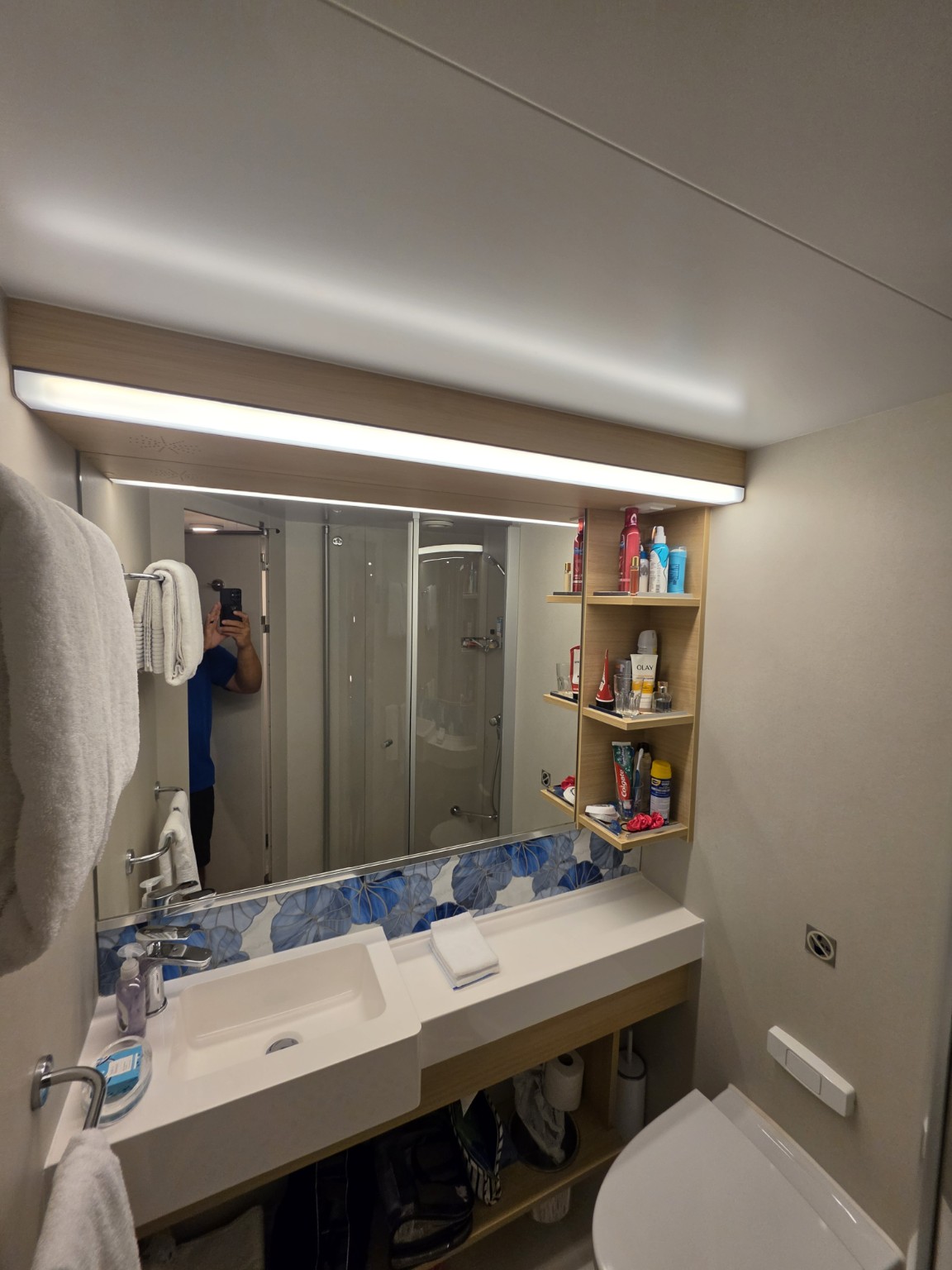 Bathroom vanity and shelving in our Wonder of the Seas balcony cabin.