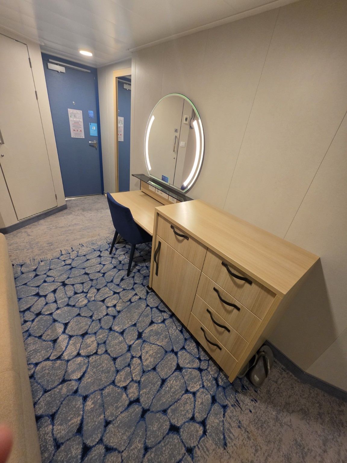 Built-in dresser and storage in our Wonder of the Seas balcony cabin.