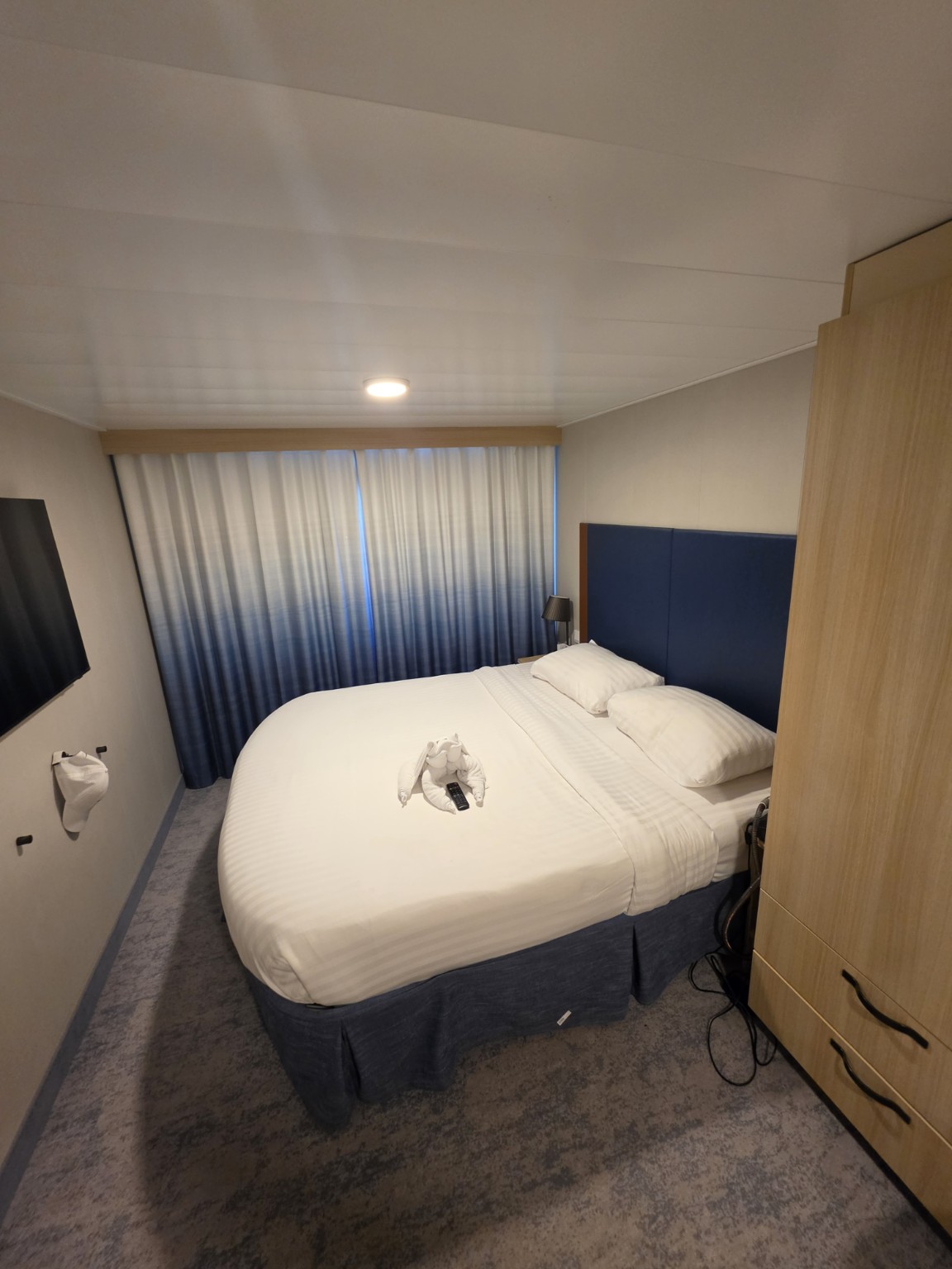 Bed area in our Wonder of the Seas balcony cabin.